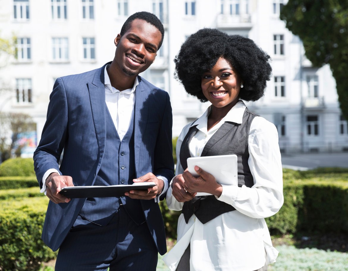 portrait-african-young-businessman-businesswoman-holding-clipboard-digital-tablet-looking-camera